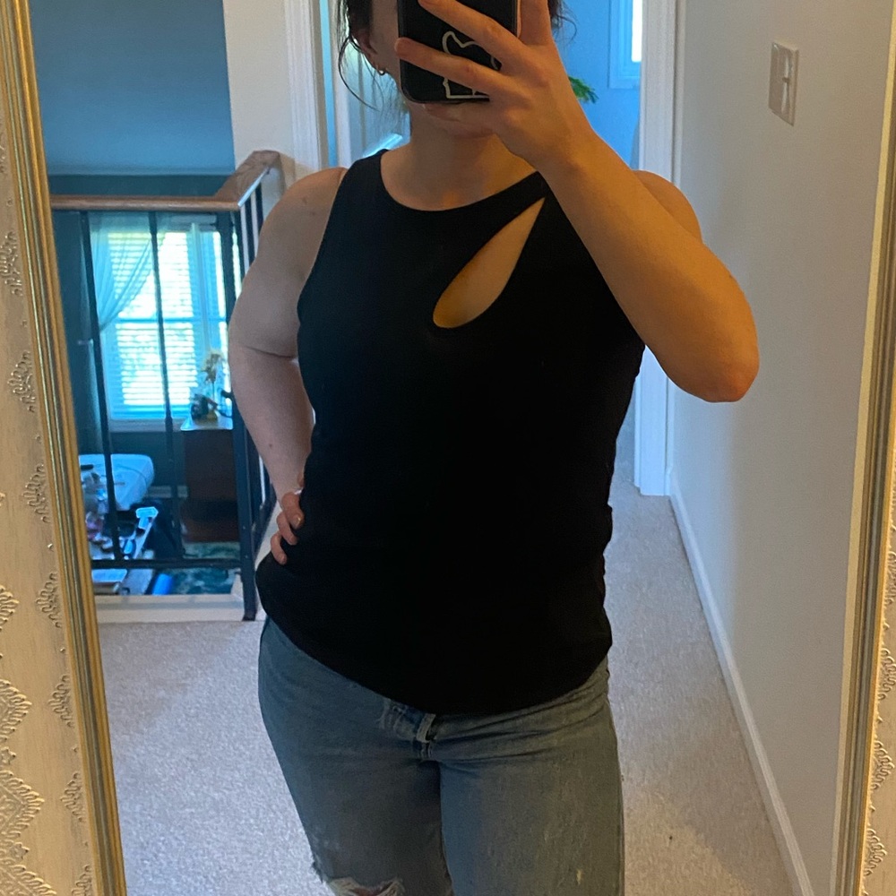 Black tank with asymmetrical cross straps and keyhole